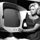 Claire Collins examining the “television of 1971,” designed by John Denison-Hunt, at the 1961 Earls Court Radio Show (Getty Images)